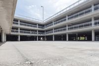 a parking garage filled with parking meters and ramps near parking garages underneath a building