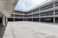 a parking garage filled with parking meters and ramps near parking garages underneath a building