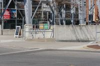 a person on a skateboard doing a trick in the air over a ramp in front of a building