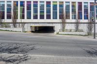 a parking garage has been opened on the corner of the road to let pedestrians into