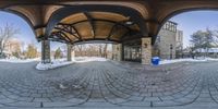 a large circular panoramic photo taken from inside an outdoor pavilion at the park