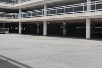 a parking garage full of vehicles with balconies on the balcony above it's balcony