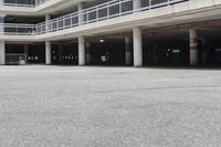 a parking garage full of vehicles with balconies on the balcony above it's balcony