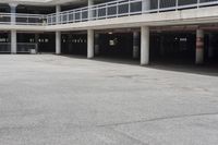 a parking garage full of vehicles with balconies on the balcony above it's balcony