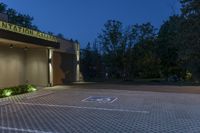 a large parking lot has a checkered pattern of concrete and stone tiles on it