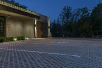 a large parking lot has a checkered pattern of concrete and stone tiles on it