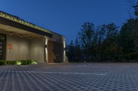 a large parking lot has a checkered pattern of concrete and stone tiles on it