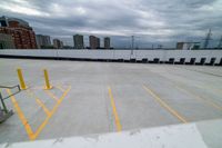 view from the bottom of an airplane over an empty parking lot with lots of windows