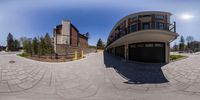 a 360 - vision image shows the front view of a building that is outside with stairs and a ramp leading to it