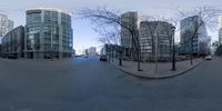 a city is reflected in a fisheye lens with no people on the streets and cars