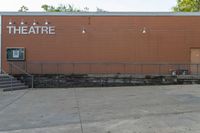 a view of a theatre and the steps leading to it is being used as a place for performing