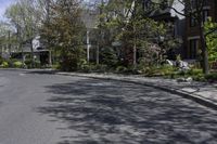 this is an image of residential houses lining the street in front of a car parks on the sidewalk