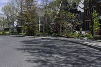 this is an image of residential houses lining the street in front of a car parks on the sidewalk