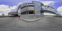 a view of a skateboard park from below the wall looking up at the building