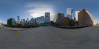 a picture taken with a fish eye lens in the city of minneapolis, michigan with buildings and sky