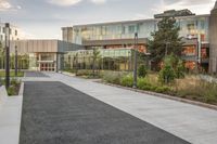 the building is full of buildings, including a parking lot and a courtyard area in front