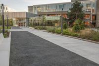 the building is full of buildings, including a parking lot and a courtyard area in front