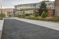 the building is full of buildings, including a parking lot and a courtyard area in front