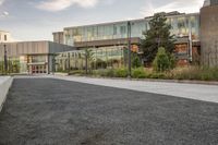 the building is full of buildings, including a parking lot and a courtyard area in front