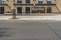 an outside of a building with signage on it that says organic coffee and barbeque