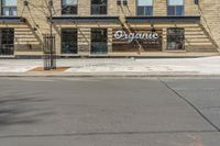 an outside of a building with signage on it that says organic coffee and barbeque