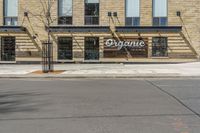 an outside of a building with signage on it that says organic coffee and barbeque