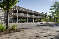 a concrete parking garage in an empty area in the city center of a suburban area