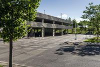 a concrete parking garage in an empty area in the city center of a suburban area