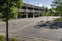 a concrete parking garage in an empty area in the city center of a suburban area