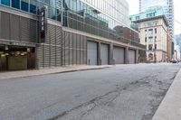 the empty city street has parked cars and parking spaces on each side of it, with a sign that says, don't leave out