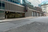 the empty city street has parked cars and parking spaces on each side of it, with a sign that says, don't leave out