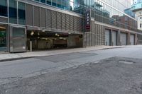 the empty city street has parked cars and parking spaces on each side of it, with a sign that says, don't leave out