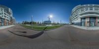 this is the view of an outdoor area in town taken from the street corner with a fisheye lens