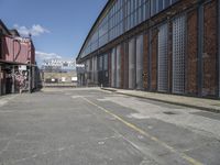 the empty warehouse area is all empty and ready to be used as a place for events