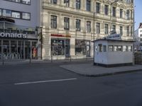 a photo of a mcdonalds building and street in germany taken during the day time