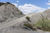 the gravel is on top of the hill and the road goes up to the hill