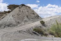 the gravel is on top of the hill and the road goes up to the hill