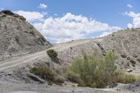 the gravel is on top of the hill and the road goes up to the hill