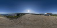 an outdoor photo taken from a fisheye lens of a tractor parked on dirt road