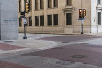 a corner with several stop lights at a city intersection and a red light at the intersection