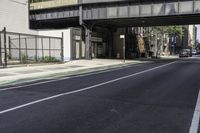 Tree Shade on Asphalt Road: Crossing the Bridge