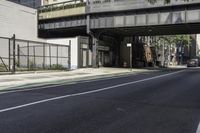 Tree Shade on Asphalt Road: Crossing the Bridge