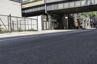 Tree Shade on Asphalt Road: Crossing the Bridge