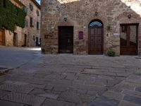 Tuscan Valley: Building with Cobblestone Road