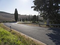 Tuscany Italy: Asphalt Road and Mountain Landscape