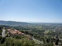 the view from a high point on the hills in italy is pretty and peaceful,