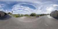 an upside down photo of a skateboarder jumping off a hill, in front of a street