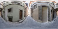 a city intersection is reflected in a fish - eye lens lens of the view outside