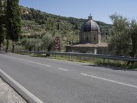 Scenic View of Tuscany Landscape with Church and Mountains in Italy