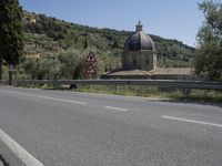 Scenic View of Tuscany Landscape with Church and Mountains in Italy